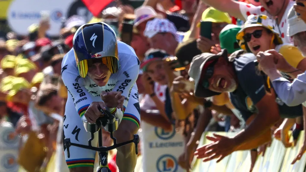 Invincible Evenepoel wins time trial, podium hopeful Lipowitz forced out of the Tour